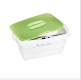 White electronic device with a green lid on a white background