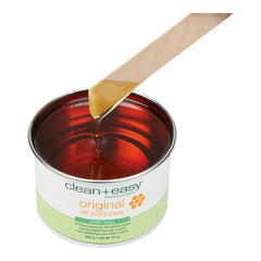 Can of clean+easy original all-purpose soft wax with a wooden applicator on a white background