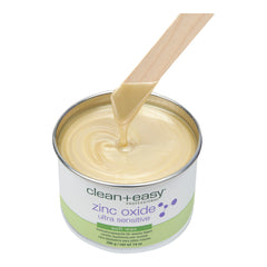 Can of clean+easy zinc oxide soft wax with a wooden applicator on a white background